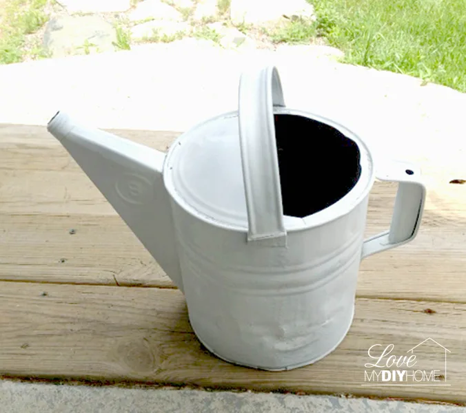 spray painted watering can