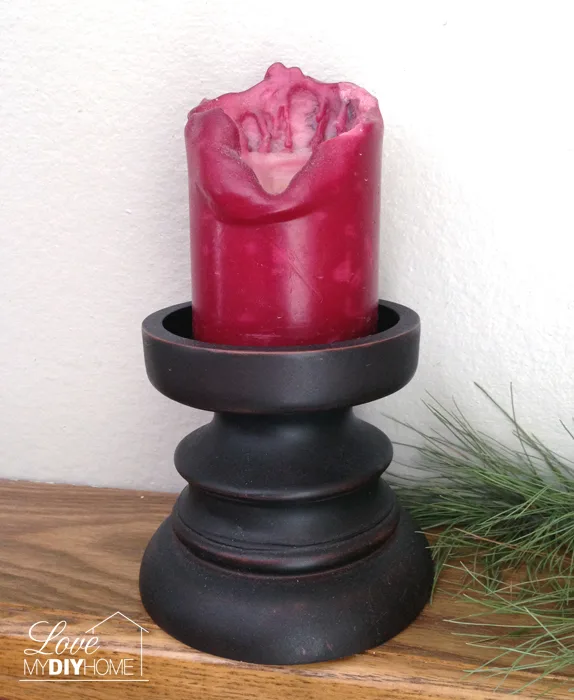 Wooden candle holder paired up with a large votive becomes a treasure