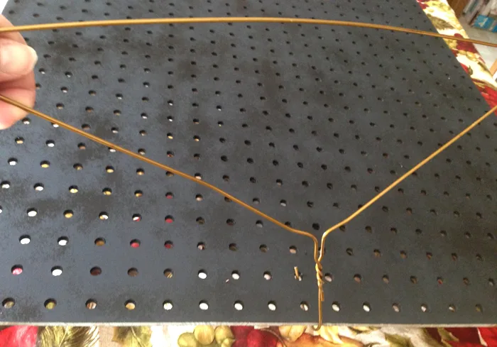 Use a coat hanger to move painted pegboard {Love My DIY Home}